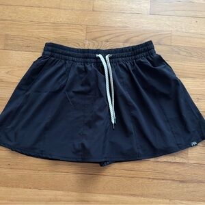 Vuori Skort Black Aria logo on front and Vuori Logo on Back Flowy Skirt